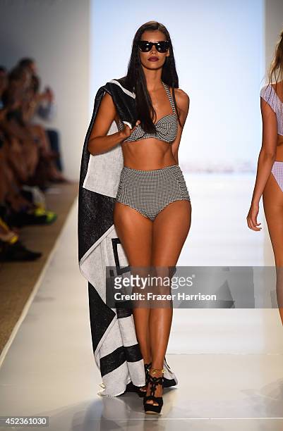 Model walks the runway at Wildfox Swim Cruise 2015 show during Mercedes-Benz Fashion Week Swim 2015 at Cabana Grande at The Raleigh on July 18, 2014...