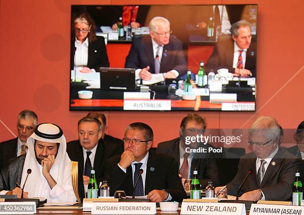 Trade Ministers of the Russian Federation Alexey Ulyukaev center, New Zealand Tim Groser right, and Tawfig bin Fouzan Al-Rabiah listen to Australia's...