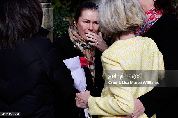 Mourners gather outside Saint Mary Magdalene Catholic Church following a service in memory of Sister Philomene Tiernan on July 19, 2014 in Sydney,...