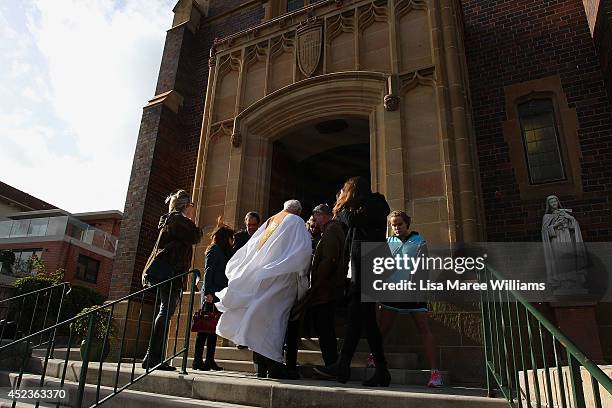 Mourners gather outside Saint Mary Magdalene Catholic Church following a service in memory of Sister Philomene Tiernan on July 19, 2014 in Sydney,...