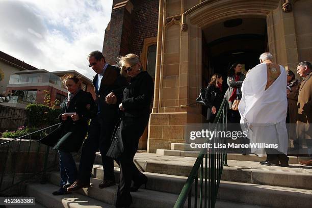 Monsignor Tony Doherty comforts parishioners outside Saint Mary Magdalene Catholic Church following a service in memory of Sister Philomene Tiernan...