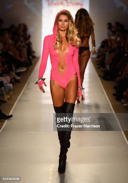 Model walks the runway at the Beach Bunny Featuring The Blonds show during Mercedes-Benz Fashion Week Swim 2015 at Cabana Grande at The Raleigh on...