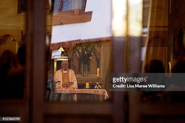 Monsignor Tony Doherty holds a service at Saint Mary Magdalene Catholic Church in memory of Sister Philomene Tiernan on July 19, 2014 in Sydney,...