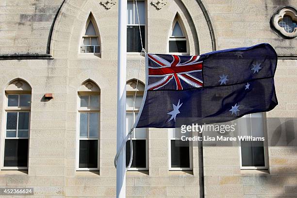The Australian flag flies at half-mast and flowers have been laid at Kincoppal Catholic School in Rose Bay in memory of Sister Philomene Tiernan on...
