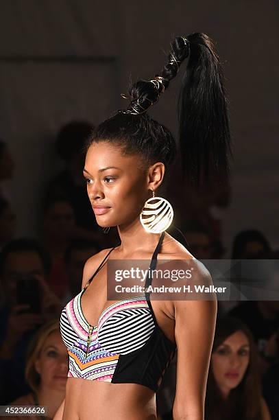 Model walks the runway at the Dolores Cortes show during Mercedes-Benz fashion Week Swim 2015 at Raleigh Hotel on July 18, 2014 in Miami Beach,...