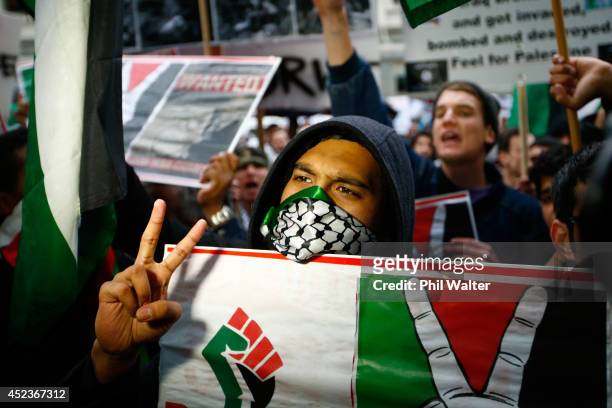 Protestors march from Aotea Square down Queen Street protesting the Israeli ground invasion of Gaza on July 19, 2014 in Auckland, New Zealand. The...