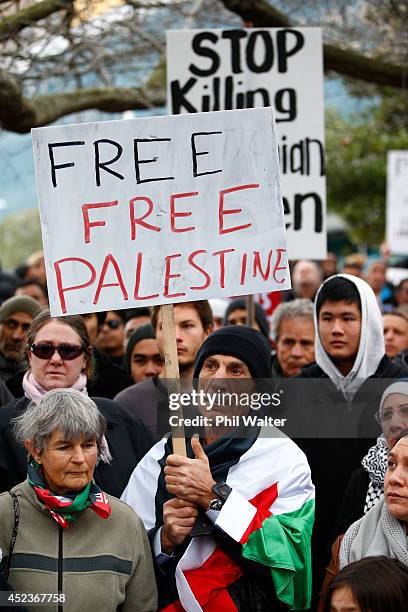 Protestors march from Aotea Square down Queen Street protesting the Israeli ground invasion of Gaza on July 19, 2014 in Auckland, New Zealand. The...