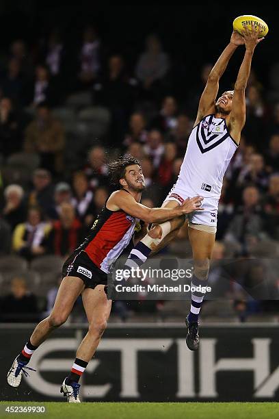 Michael Johnson of the Dockers marks the ball against Dylan Roberton of the Saints during the round 18 AFL match between the St Kilda Saints and the...