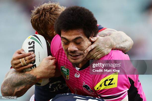 Sika Manu of the Panthers is tackled during the round 19 NRL match between the Sydney Roosters and the Penrith Panthers at Allianz Stadium on July...