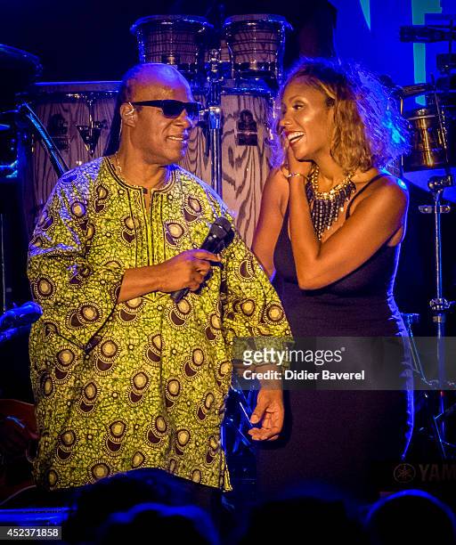 Stevie Wonder and his daughter Aisha Morris perform on stage at the 54th 'Jazz A Juan' Festival on July 18, 2014 in Juan-les-Pins, France.
