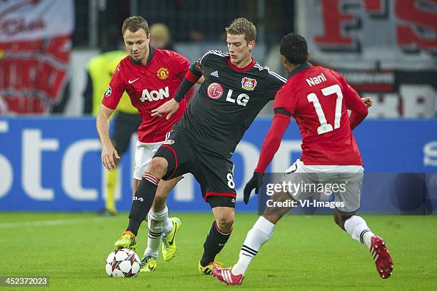 Jonny Evans of Manchester United, Lars Bender of Bayer Leverkusen, Nani of Manchester United during the Champions League match between Bayer...
