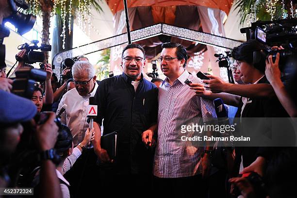 Malaysian Defense Minister Hishammuddin Hussein and Transport Minister Liow Tiong Lai address the members of media on July 19, 2014 in Kuala Lumpur,...