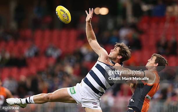 Tom Hawkins of the Cats competes for a mark with Phil Davis of the Giants during the round 18 AFL match between the Greater Western Sydney Giants and...