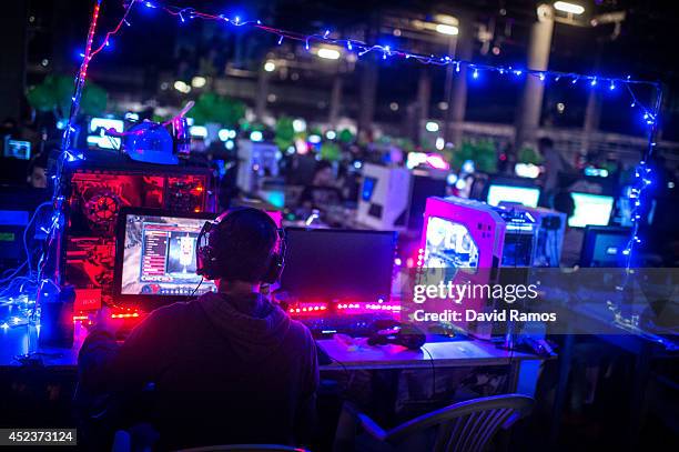 Participant plays on his computer during the DreamHack Valencia 2014 on July 18, 2014 in Valencia, Spain. Dreamhack Valencia is one of the European...