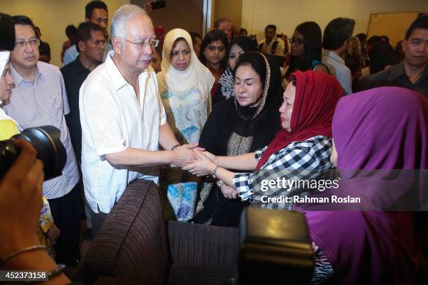 Malaysian Prime Minister Najib Razak and his wife Rosmah Mansor meet family members of the MH17 victim on July 19, 2014 in Kuala Lumpur, Malaysia....