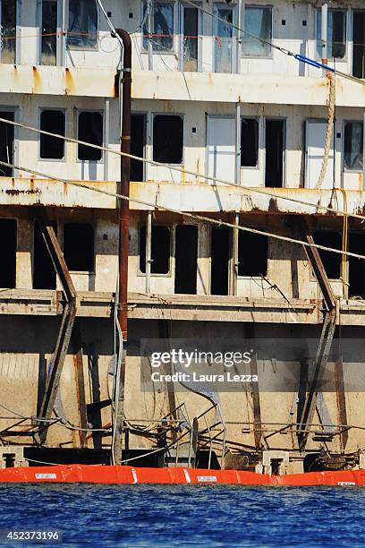 The inscription Costa is visible from the submerged port side of the wrecked cruise ship as it sits in the water after the first stage of the...