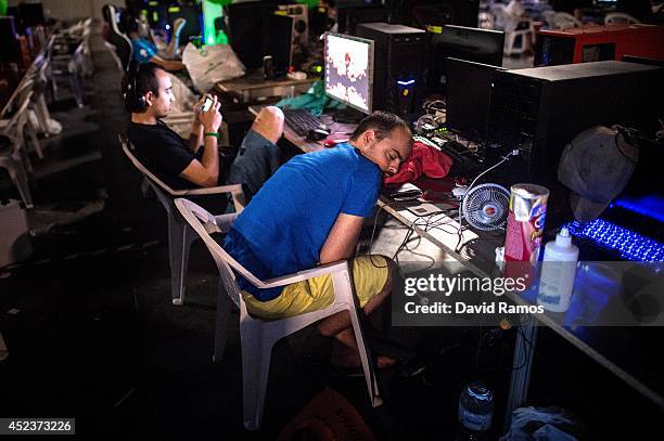 Participant spleeps after spending the night at the LAN area during the DreamHack Valencia 2014 on July 19, 2014 in Valencia, Spain. Dreamhack...