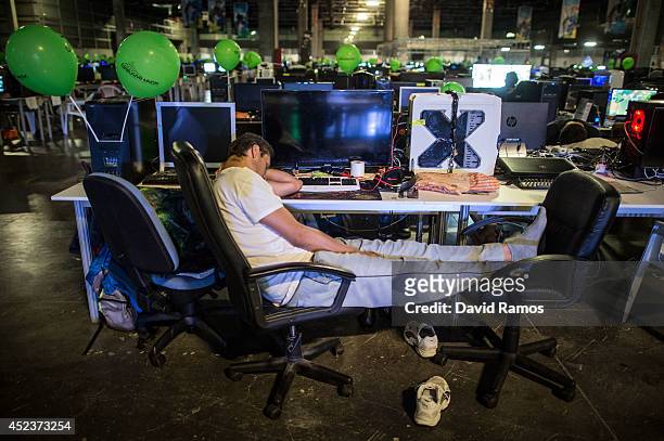 Participant spleeps after spending the night at the LAN area during the DreamHack Valencia 2014 on July 19, 2014 in Valencia, Spain. Dreamhack...