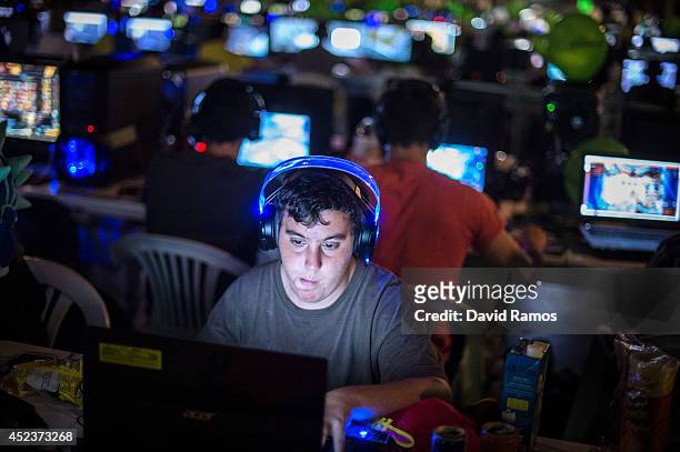 Participant plays on his computer during the DreamHack Valencia 2014 on July 18, 2014 in Valencia, Spain. Dreamhack Valencia is one of the European...