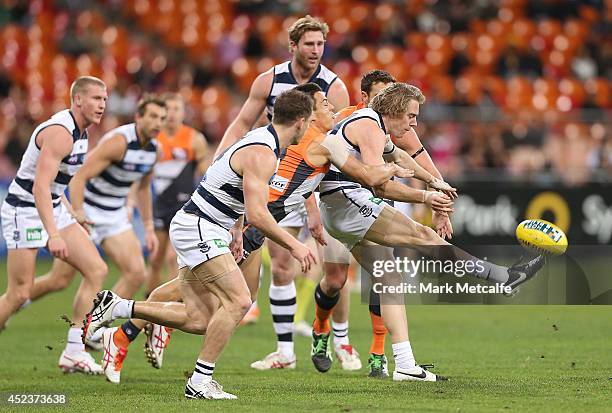 Cameron Guthrie of the Cats kicks upfield during the round 18 AFL match between the Greater Western Sydney Giants and the Geelong Cats at Spotless...