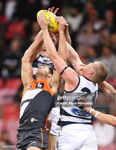Callan Ward of the Giants takes a mark in front of Josh Caddy of the Cats during the round 18 AFL match between the Greater Western Sydney Giants and...