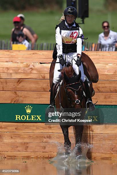 Sandra Auffarth of Germany rides on Opgun Louvo an won the the DHL Price Cross Country Test at Aachener Soers on July 19, 2014 in Aachen, Germany.