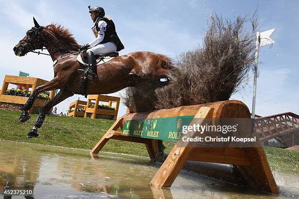 Sandra Auffarth of Germany rides on Opgun Louvo an won the the DHL Price Cross Country Test at Aachener Soers on July 19, 2014 in Aachen, Germany.