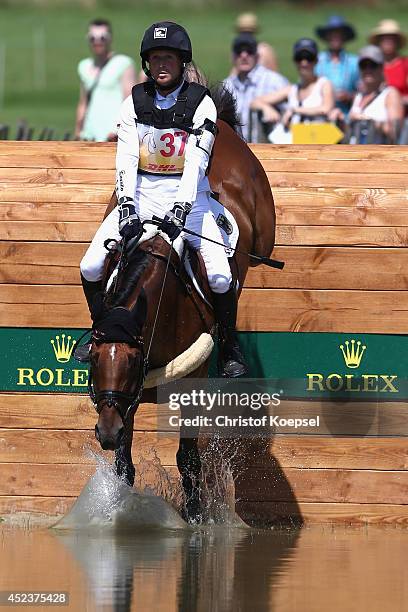 Michael Jung of Germany rides on La Biosthetique-Sam FBW during the DHL Price Cross Country Test at Aachener Soers on July 19, 2014 in Aachen,...