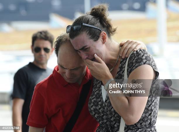 Woman cries in front of Schiphol airport on July 19 two days after Malaysia Airlines flight MH17 carrying 298 people from Amsterdam to Kuala Lumpur...