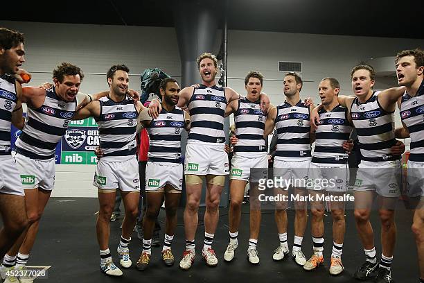 Cats players sing the club song after victory in the round 18 AFL match between the Greater Western Sydney Giants and the Geelong Cats at Spotless...