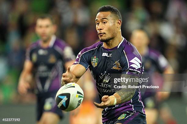 Ben Roberts of the Storm offloads the ball during the round 19 NRL match between the Melbourne Storm and the Canberra Raiders at AAMI Park on July...