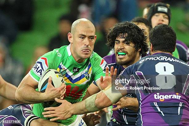 Terry Campese of the Raiders runs with the ball during the round 19 NRL match between the Melbourne Storm and the Canberra Raiders at AAMI Park on...