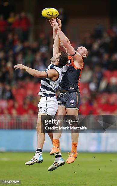 Jimmy Bartel of the Cats competes for the ball against Josh Hunt of the Giants during the round 18 AFL match between the Greater Western Sydney...