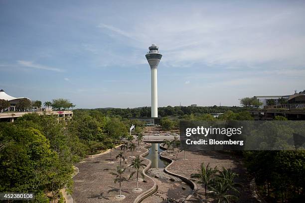 The control tower stands at Kuala Lumpur International Airport in Sepang, Malaysia, on Saturday, July 19, 2014. Flags in Malaysia flew at half-mast...