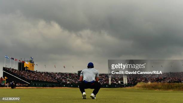 Rory McIlroy of Northern Ireland watches his second shot on the 18th hole during the third round of The 143rd Open Championship at Royal Liverpool on...