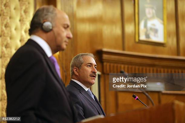 Foreign Minister of France Laurent Fabius holds a press conference with his Jordanian counterpart Nasser Judeh upon his arrival for talkson July 19...