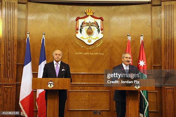 Foreign Minister of France Laurent Fabius holds a press conference with his Jordanian counterpart Nasser Judeh upon his arrival for talkson July 19...