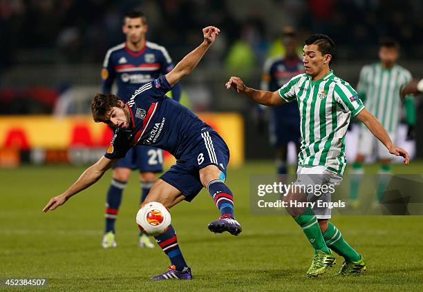 Yoann Gourcuff of Lyon is challenged by Juanfran of Real Betis during the UEFA Europa League Group I match between Olympique Lyonnais and Real Betis...