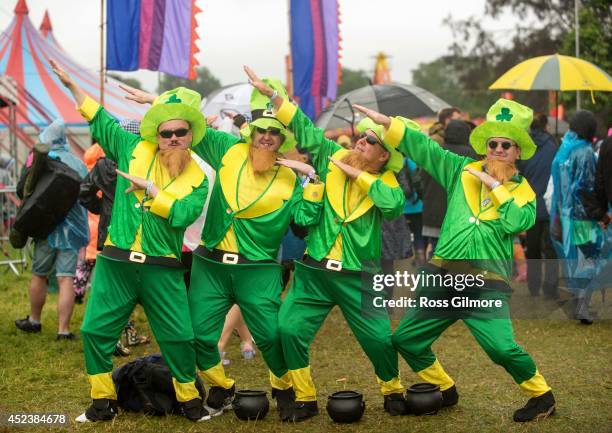 Festival goers endure the rain at the Rewind Festival at Scone Palace on July 19, 2014 in Perth, United Kingdom.