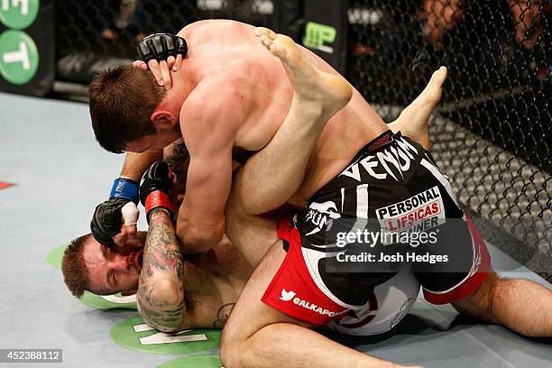 Nikita Krylov punches down at Cody Donovan in their light heavyweight bout during the UFC Fight Night event at The O2 Dublin on July 19, 2014 in...