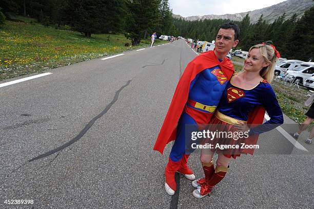 Two fans dressed as Superman and Superwoman watch the event during Stage 14 of the Tour de France on July 19, 2014 in Risoul, France.