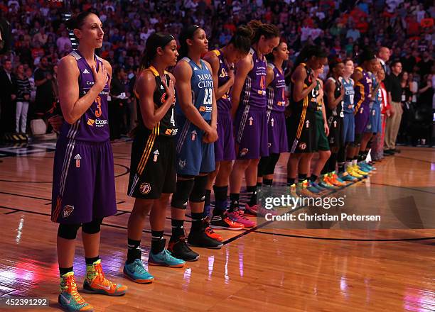 Western Conference All-Star Diana Taurasi of the Phoenix Mercury stands attended with teamamtes during the National Anthem to the WNBA All-Star Game...