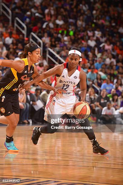 Ivory Latta of the Eastern Conference All-Stars dribbles against Skylar Diggins of the Western Conference All-Stars during the 2014 Boost Mobile WNBA...