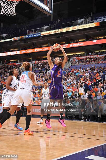 Brittney Griner of the Western Conference All-Stars shoots against Erika de Souza of the Eastern Conference All-Stars during the 2014 Boost Mobile...