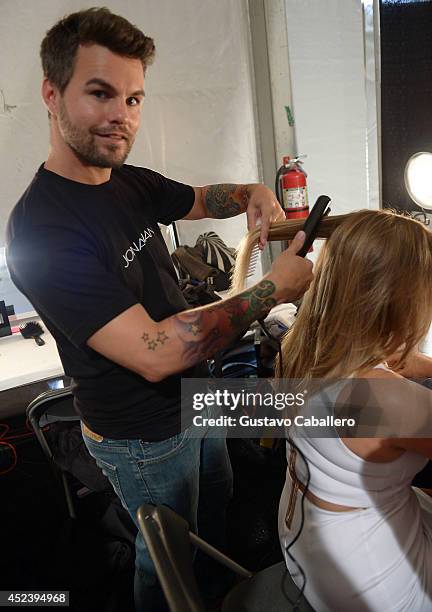 Stylist Jonathan Powell prepares Designer Monica Wise backstage at L*SPACE By Monica Wise with Jonathan Product during Mercedes-Benz Fashion Week...