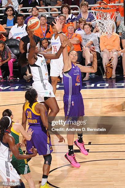 Tina Charles of the Eastern Conference All-Stars shoots against Brittney Griner of the Western Conference All-Stars during the 2014 Boost Mobile WNBA...