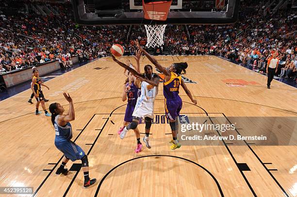 Jessica Breland of the Eastern Conference All-Stars shoots against Nneka Ogwumike of the Western Conference All-Stars during the 2014 Boost Mobile...