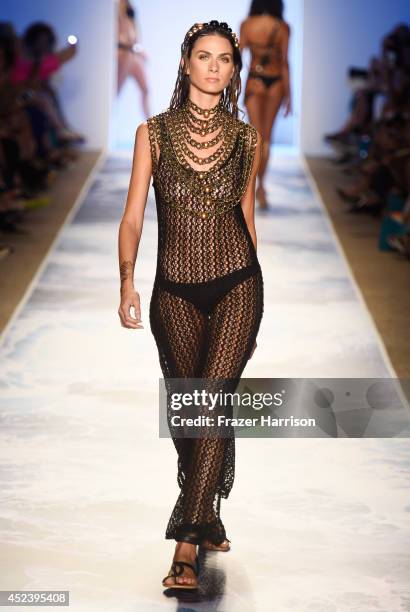 Model walks the runway at the L*Space By Monica Wise fashion show during Mercedes-Benz Fashion Week Swim 2015 at Cabana Grande at The Raleigh on July...