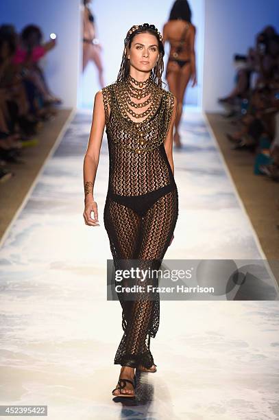 Model walks the runway at the L*Space By Monica Wise fashion show during Mercedes-Benz Fashion Week Swim 2015 at Cabana Grande at The Raleigh on July...