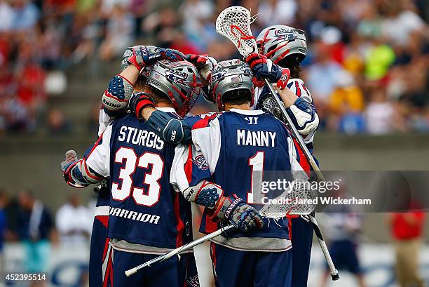 Manny Will and Shane Sturgis of the Boston Cannons celebrate a goal in the first half against the New York Lizards during the game at Harvard Stadium...